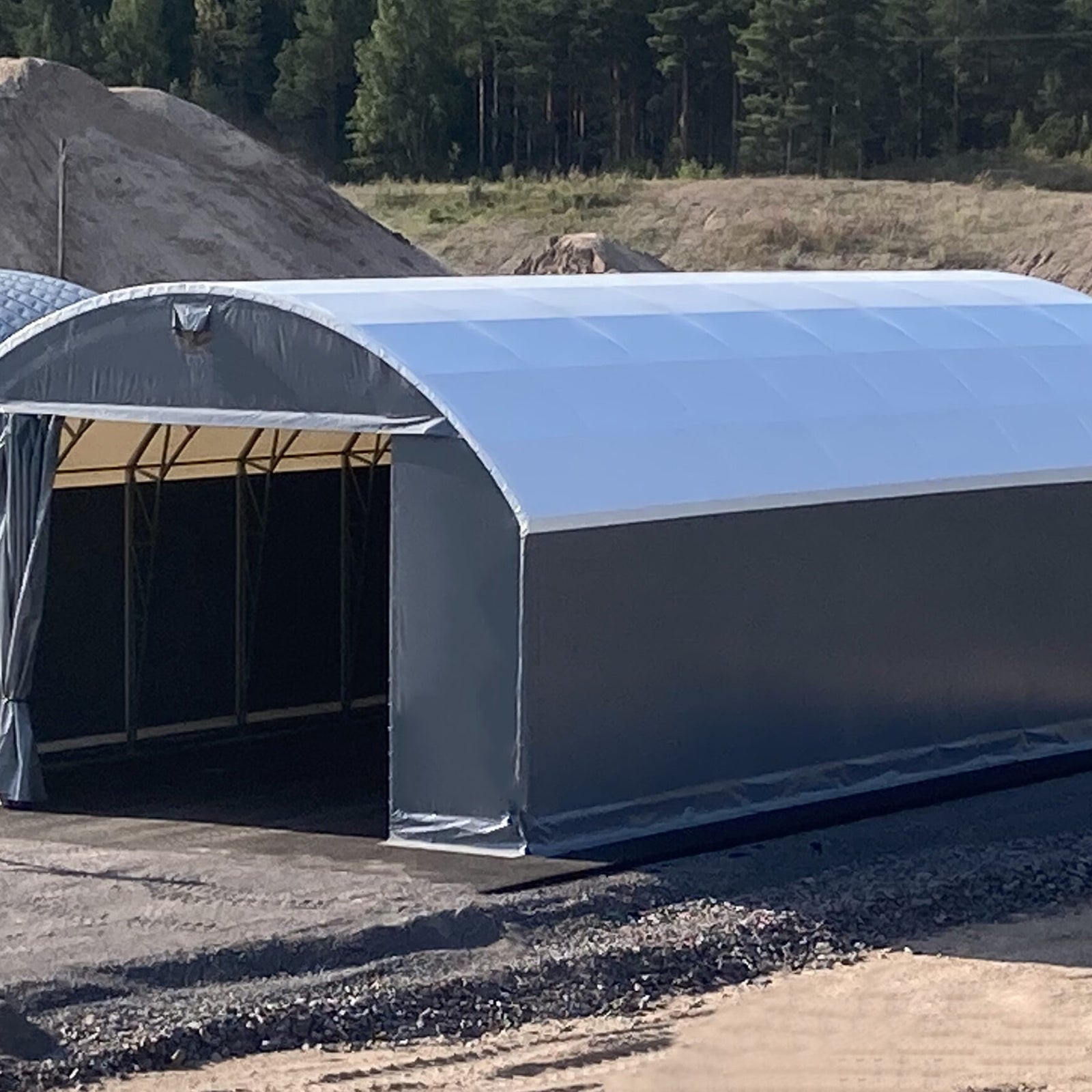 Raskaan kaluston suoja/huoltohalli - Landtek